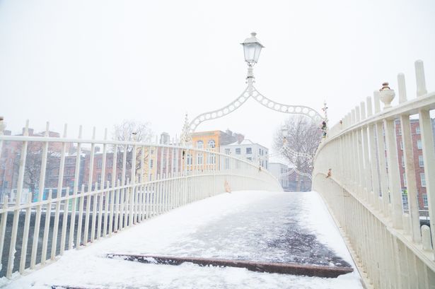 The Ha'penny bridge covered in snow and ice in Dublin City, Ireland